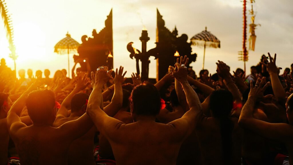 A vibrant cultural festival at sunset with a crowd and traditional rituals. Energetic and atmospheric.